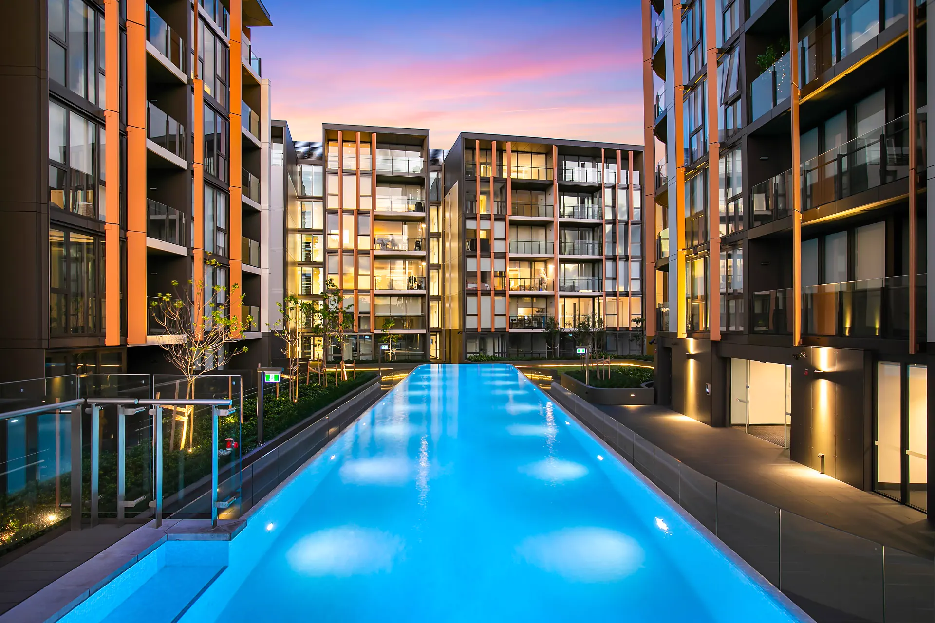 The Grand Residences pool courtyard at dusk